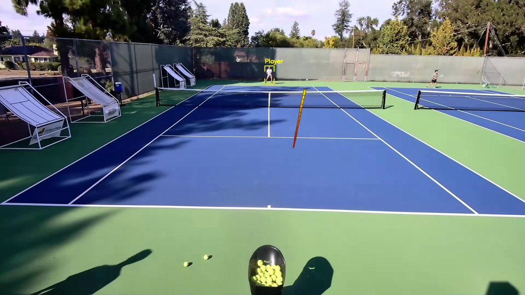 Closed-loop training scene showing court, player, and ball trajectory.